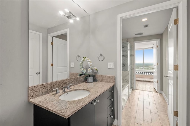 bathroom featuring hardwood / wood-style floors and vanity