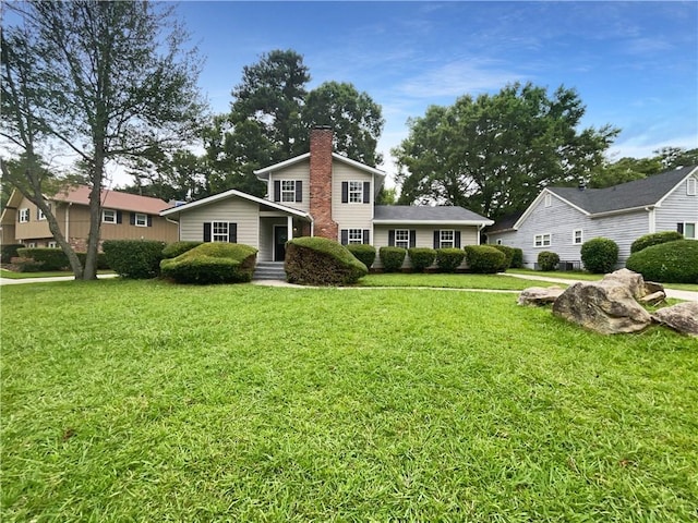 view of front of property with a front lawn