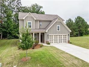 craftsman-style house with a garage and a front yard