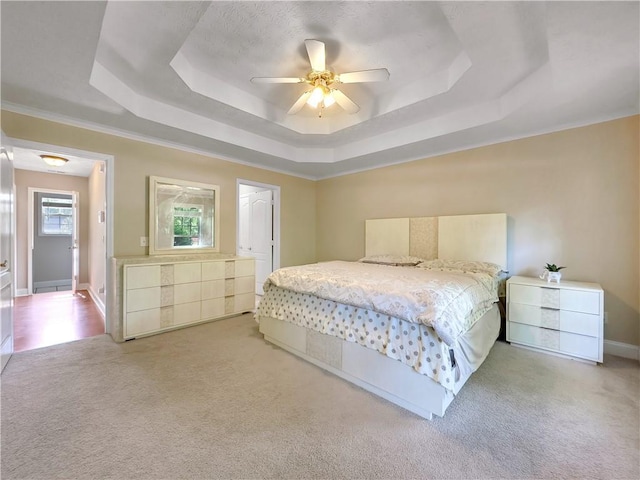 1012 Gloria Grand Blvd, Mcdonough, GA 30252 - carpeted bedroom featuring a raised ceiling, ceiling fan, crown molding, and baseboards