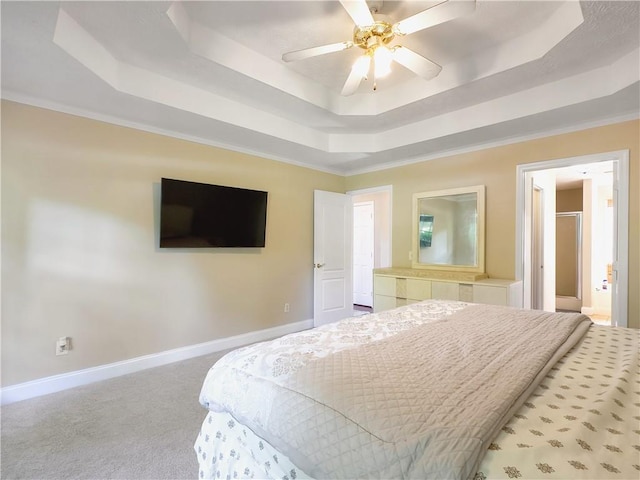1012 Gloria Grand Blvd, Mcdonough, GA 30252 - bedroom featuring a tray ceiling, carpet, baseboards, and ensuite bathroom