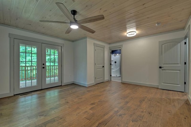 unfurnished room featuring crown molding, hardwood / wood-style flooring, wooden ceiling, and french doors