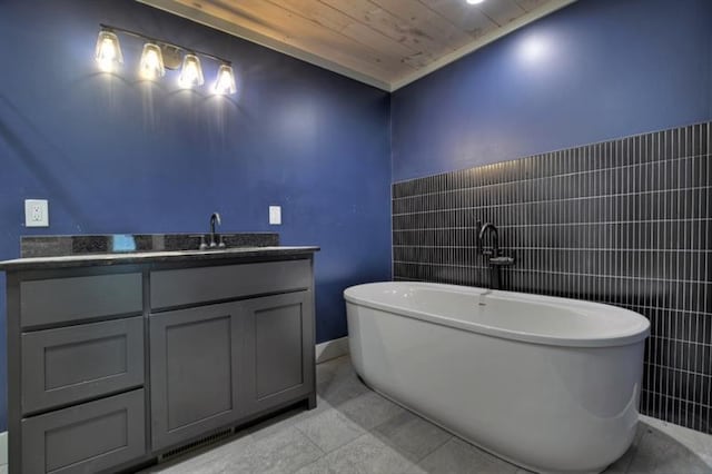 bathroom with vanity, tile patterned flooring, a washtub, and wooden ceiling