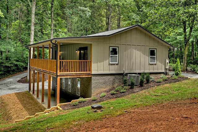 view of side of property with central air condition unit