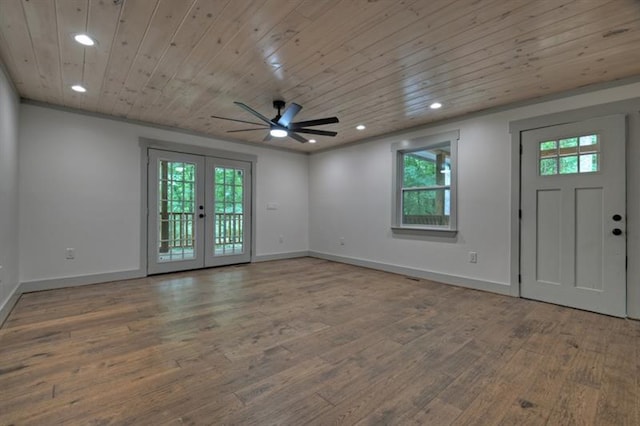 foyer featuring french doors, ceiling fan, wood-type flooring, and wood ceiling