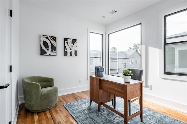 office space with hardwood / wood-style floors