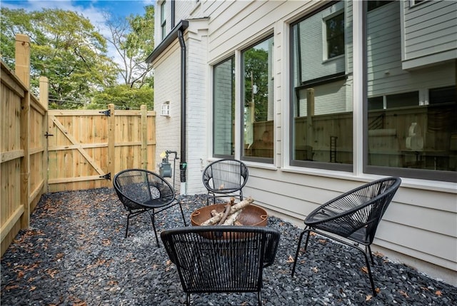 view of patio / terrace featuring an outdoor fire pit