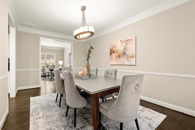 dining space with ornamental molding, visible vents, dark wood finished floors, and baseboards