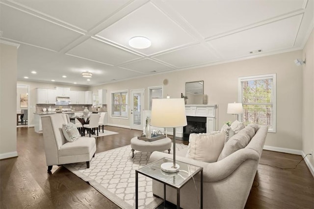 living area with coffered ceiling, a fireplace, baseboards, and dark wood finished floors