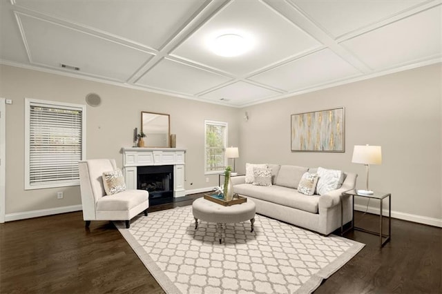 living area with dark wood-style flooring, coffered ceiling, a fireplace with raised hearth, and baseboards