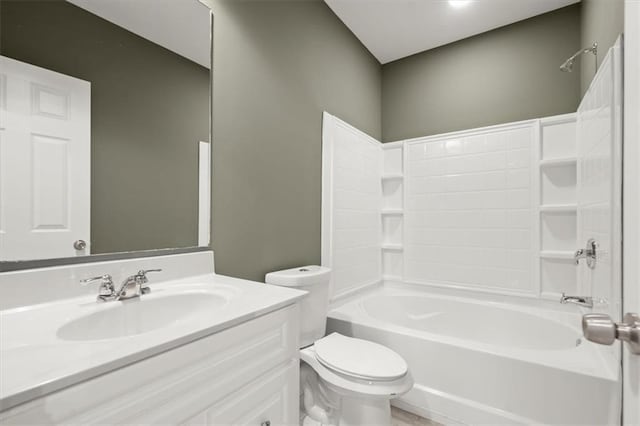 bathroom with toilet, vanity, and shower / tub combination