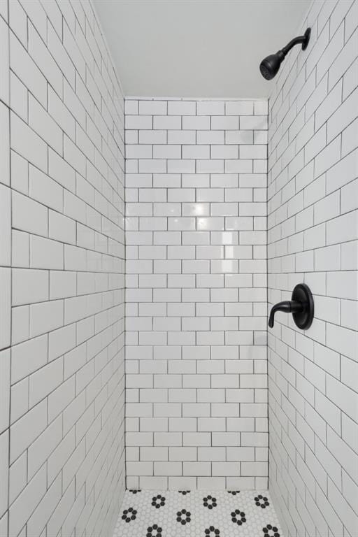 bathroom with a tile shower