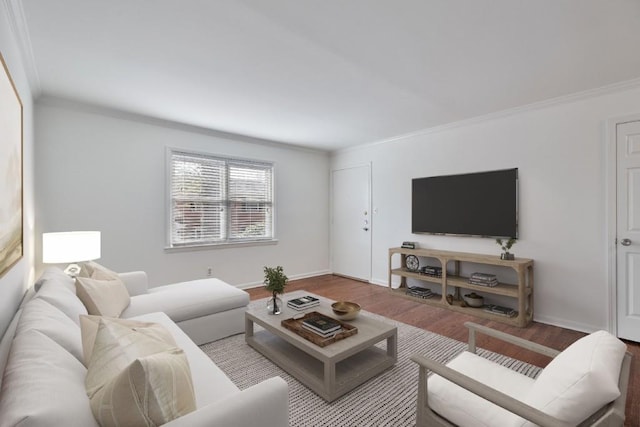 living room with hardwood / wood-style flooring and ornamental molding