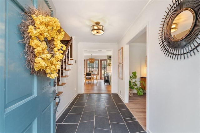 foyer with dark hardwood / wood-style flooring and crown molding