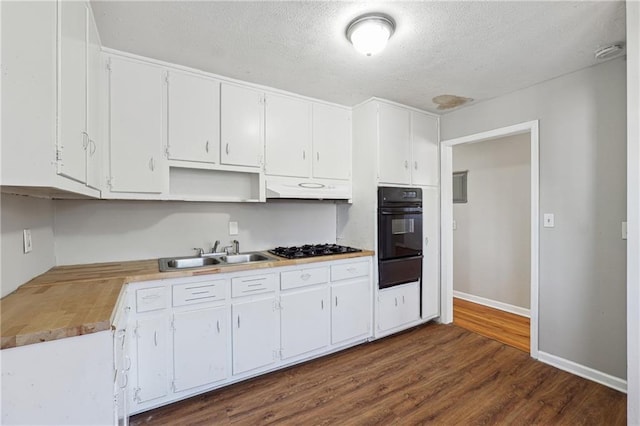 kitchen featuring black appliances, sink, a textured ceiling, white cabinets, and dark hardwood / wood-style flooring