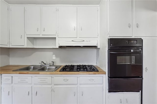 kitchen featuring sink, white cabinets, and black gas stovetop