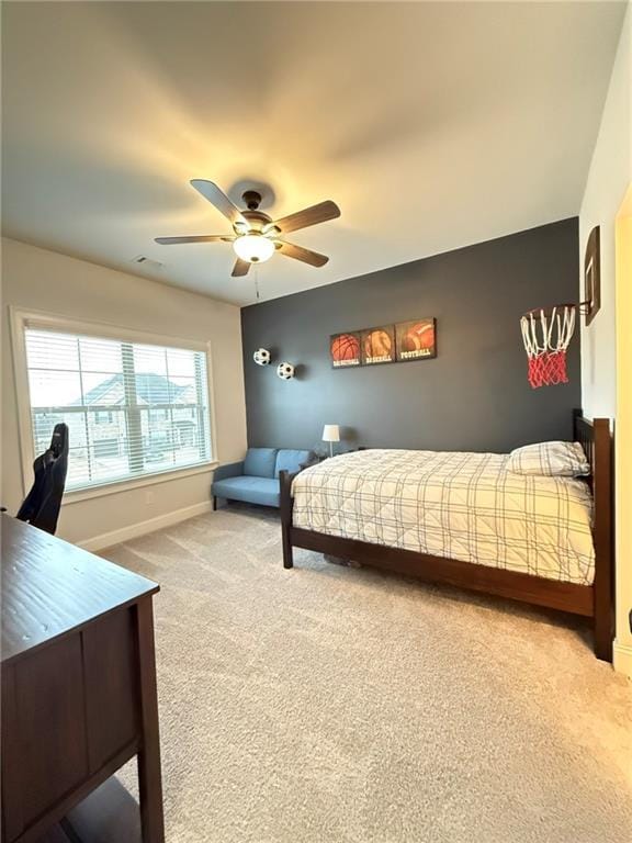 bedroom with ceiling fan and carpet