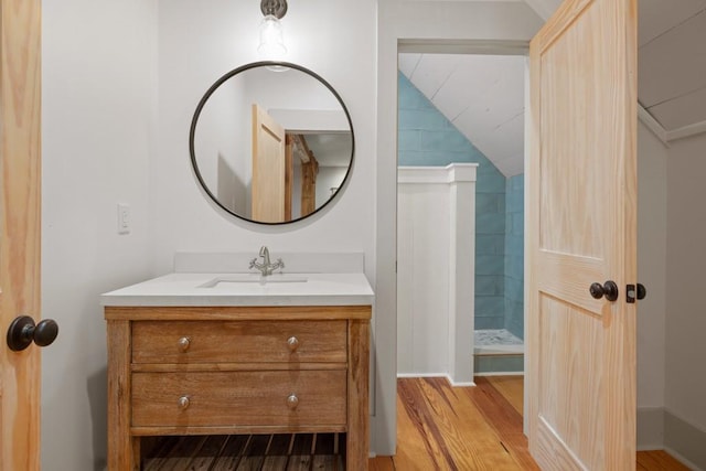 bathroom featuring vanity and wood-type flooring