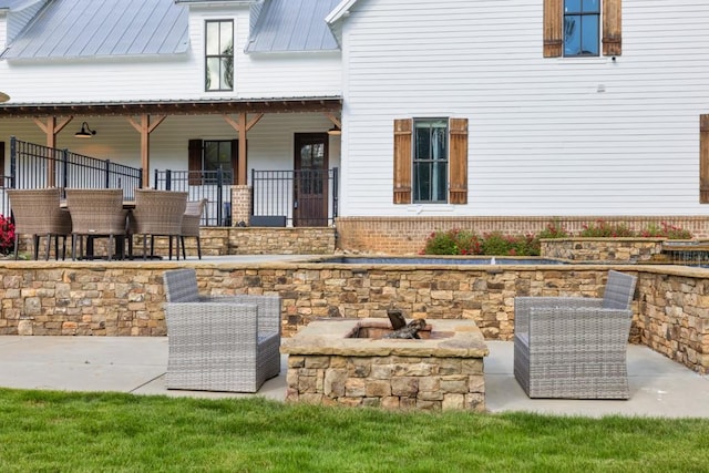 view of patio featuring a fire pit