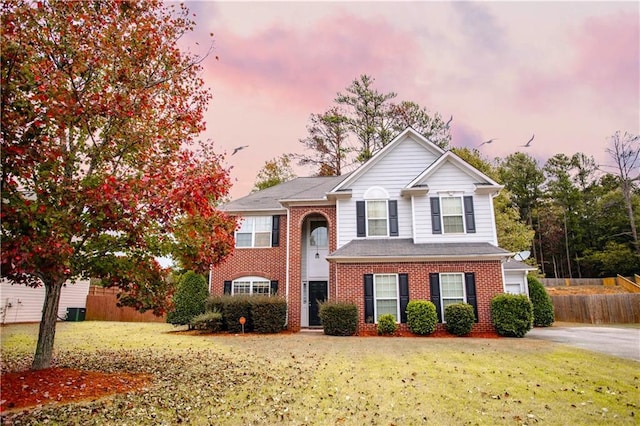 view of front of property with a lawn