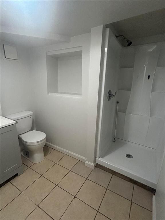 6072 Holiday Blvd, Forest Park, GA 30265 - bathroom with tile patterned flooring, vanity, a stall shower, and baseboards