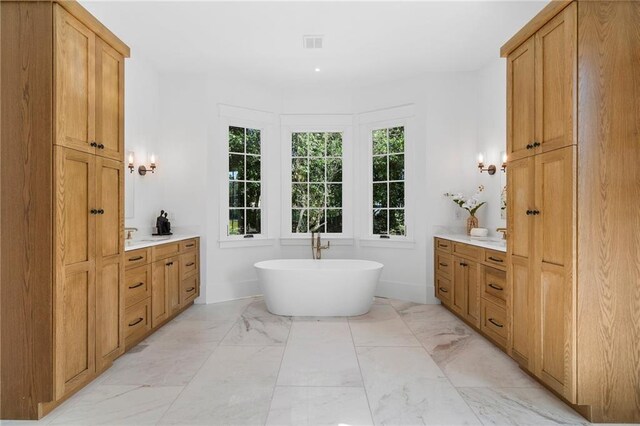 bathroom with vanity and separate shower and tub