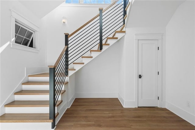 stairs with wood-type flooring