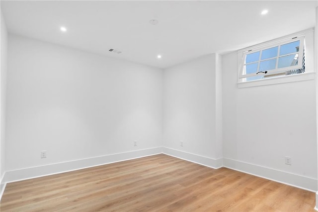 spare room featuring light hardwood / wood-style flooring