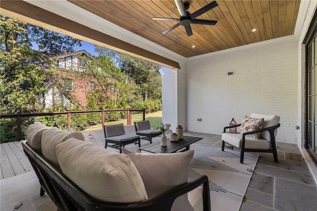 view of patio with a wooden deck, ceiling fan, and an outdoor hangout area