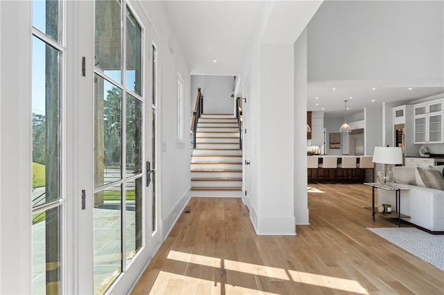 foyer entrance featuring light hardwood / wood-style floors