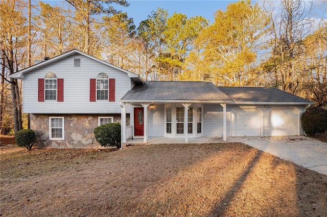 view of front of home featuring covered porch and a garage