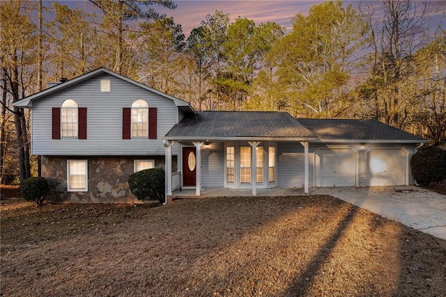 view of front of house featuring covered porch and a garage