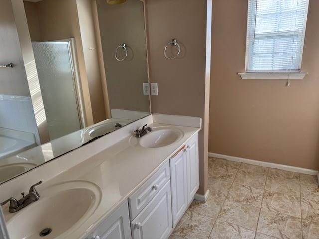 bathroom with vanity and a tub