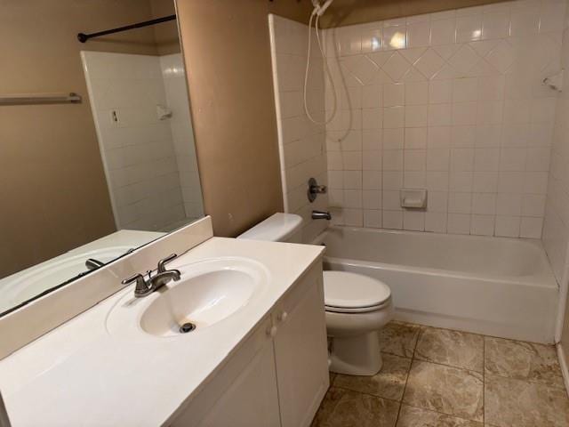 full bathroom with vanity, tiled shower / bath, and toilet