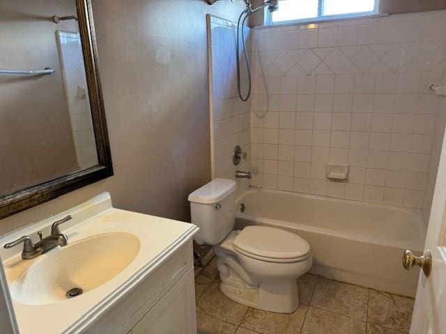 full bathroom featuring tile patterned flooring, tiled shower / bath combo, toilet, and vanity