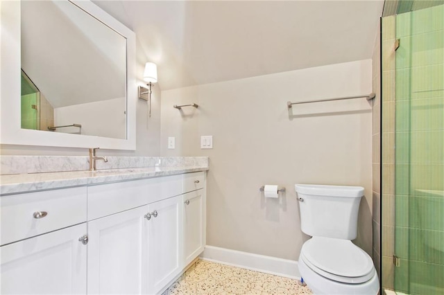 bathroom featuring vanity, toilet, and walk in shower