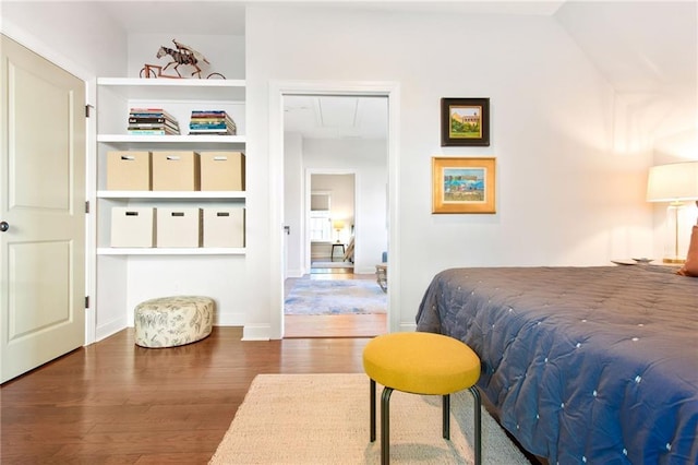 bedroom featuring a closet and dark hardwood / wood-style floors