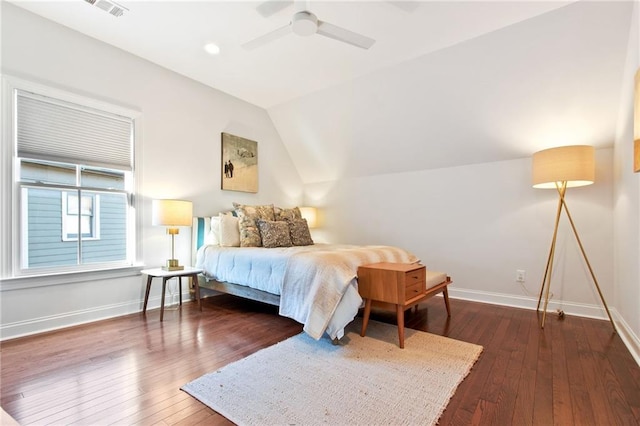 bedroom featuring ceiling fan, dark hardwood / wood-style flooring, and lofted ceiling