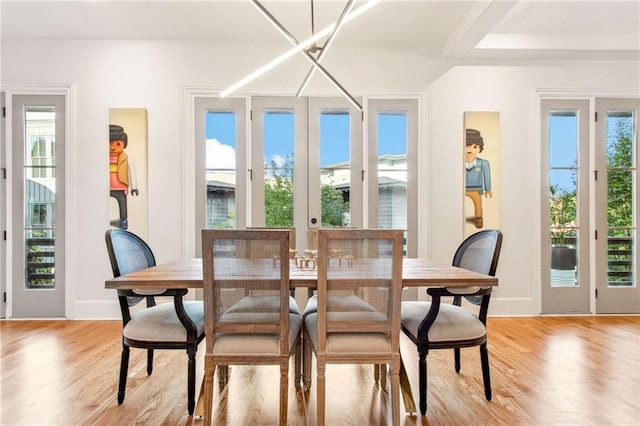 dining space with a healthy amount of sunlight and light wood-type flooring