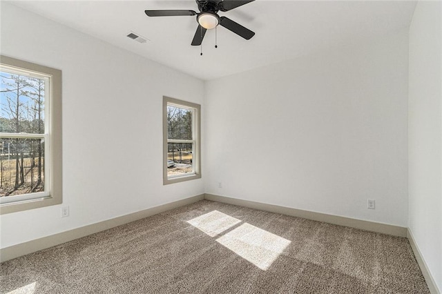 unfurnished room featuring carpet floors and ceiling fan