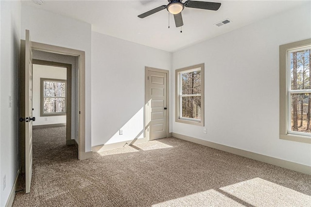 unfurnished bedroom with carpet and ceiling fan