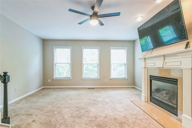 4358 Grove Field Ct, Suwanee, GA 30024 - unfurnished living room featuring a ceiling fan, carpet floors, a high end fireplace, and baseboards