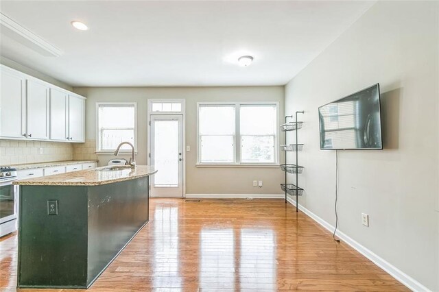 4358 Grove Field Ct, Suwanee, GA 30024 - empty room featuring healthy amount of natural light, carpet flooring, a ceiling fan, and baseboards