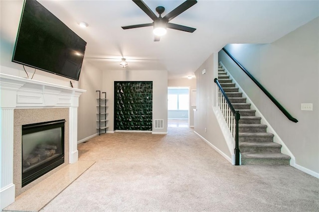 4358 Grove Field Ct, Suwanee, GA 30024 - unfurnished living room featuring ceiling fan, light carpet, stairs, a premium fireplace, and baseboards