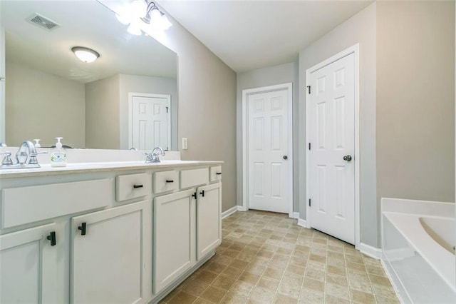 4358 Grove Field Ct, Suwanee, GA 30024 - bathroom featuring double vanity and a garden tub