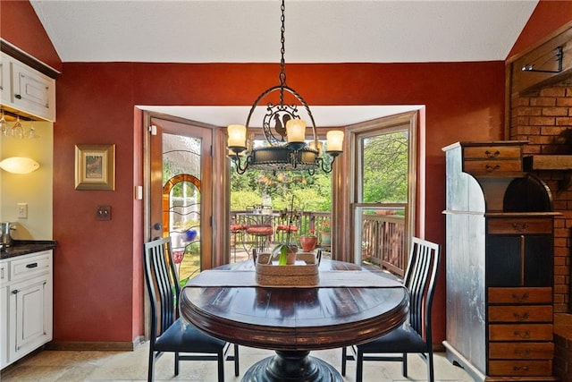 4820 Coppedge Trl, Peachtree Corners, GA 30096 - dining area featuring vaulted ceiling, baseboards, and a chandelier