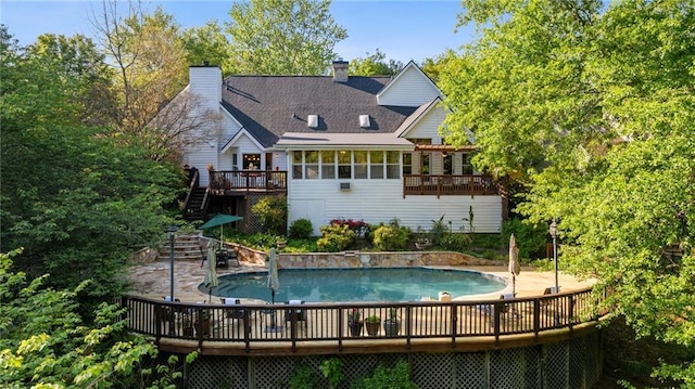4820 Coppedge Trl, Peachtree Corners, GA 30096 - back of property with a wooden deck, stairway, a chimney, and an outdoor pool