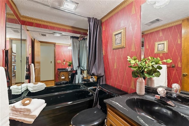 4820 Coppedge Trl, Peachtree Corners, GA 30096 - bathroom featuring a textured ceiling, vanity, a tub to relax in, and toilet