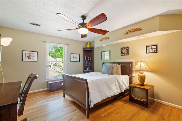4820 Coppedge Trl, Peachtree Corners, GA 30096 - bedroom featuring light wood-style floors, baseboards, a textured ceiling, and ceiling fan