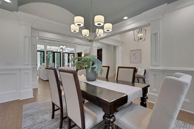 821 Camden Park Ct, Atlanta, GA 30342 - dining room featuring a chandelier, a decorative wall, wood finished floors, recessed lighting, and crown molding